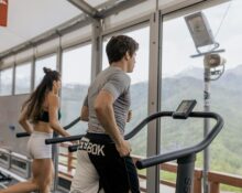 Person doing cardio exercises in gym on treadmill