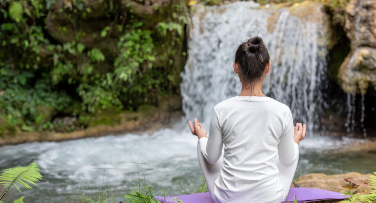 A peaceful garden setting representing a natural healing haven with herbal teas and plants.