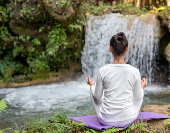 A peaceful garden setting representing a natural healing haven with herbal teas and plants.