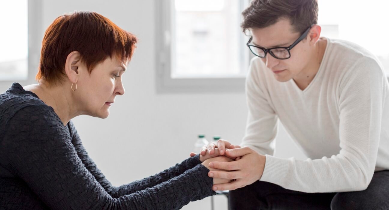 A person practicing daily depression support tips like journaling and drinking herbal tea in a bright room.