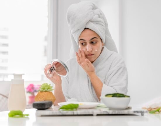 Natural ingredients like honey and turmeric used as home remedies for glowing skin on a clean background