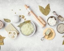 Organic and natural skincare ingredients like aloe vera, honey, and essential oils on a white background