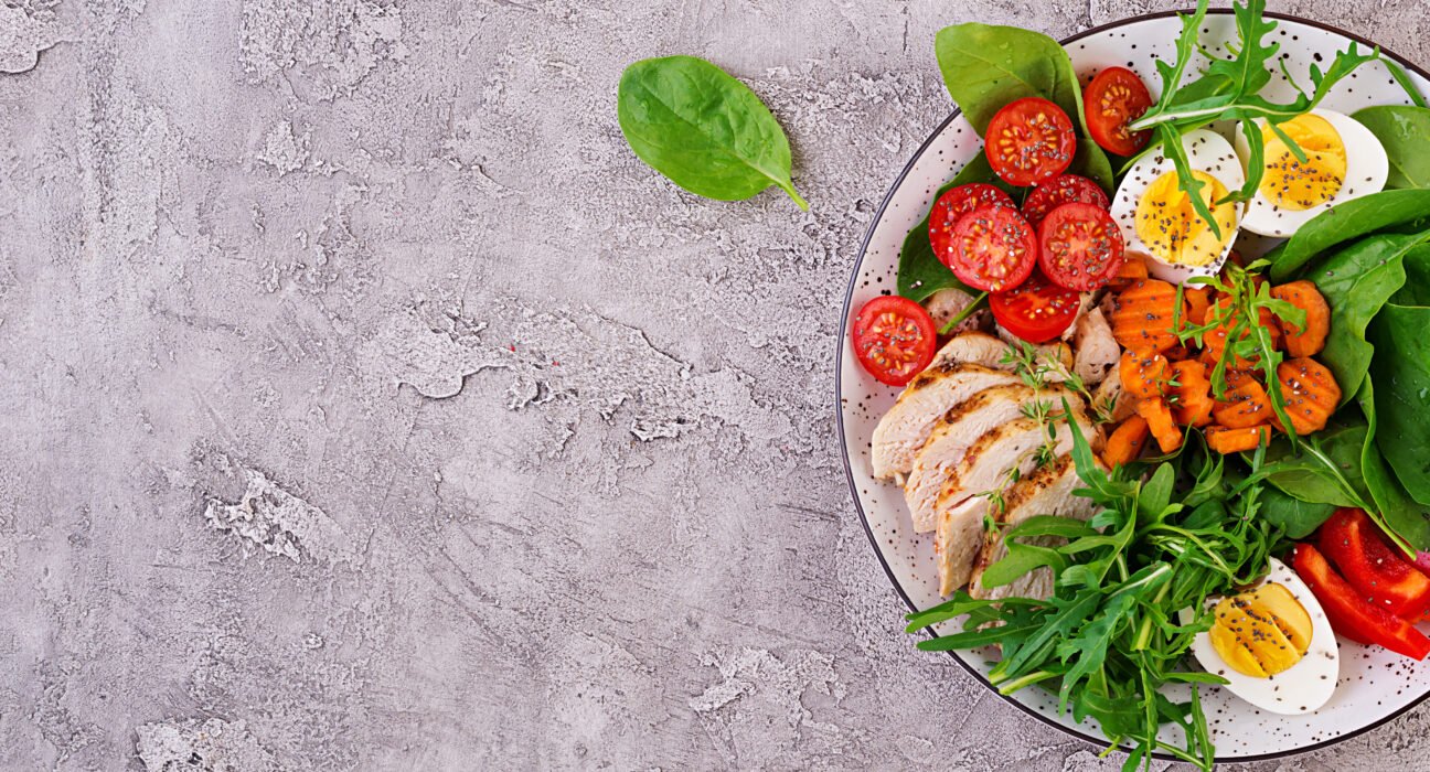 Organized glass containers filled with healthy meal prep ideas like roasted vegetables, quinoa, and lean protein for a busy professional's busy week