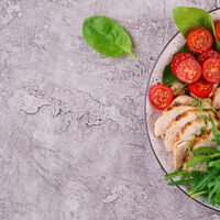 Organized glass containers filled with healthy meal prep ideas like roasted vegetables, quinoa, and lean protein for a busy professional's busy week