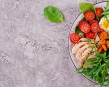 Organized glass containers filled with healthy meal prep ideas like roasted vegetables, quinoa, and lean protein for a busy professional's busy week