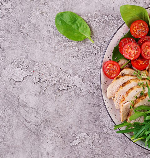 Organized glass containers filled with healthy meal prep ideas like roasted vegetables, quinoa, and lean protein for a busy professional's busy week