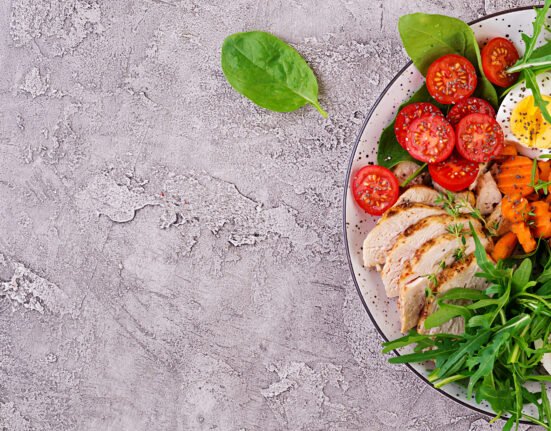 Organized glass containers filled with healthy meal prep ideas like roasted vegetables, quinoa, and lean protein for a busy professional's busy week